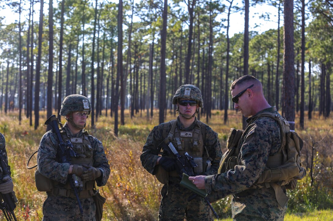 Chief Warrant Officer 2 Michael Hulsey briefs Marines after a training exercise at Camp Lejeune, N.C., Nov 16, 2016. The Marines practiced squad-sized movements in order to maintain unit readiness for their upcoming Integrated Training Exercise at the Marine Corps Air Ground Combat Training Center in Twentynine Palms, California. Hulsey is the infantry weapons officer for 1st Battalion, 8th Marine Regiment.  (U.S. Marine Corps Photo by Lance Cpl. Jon Sosner)