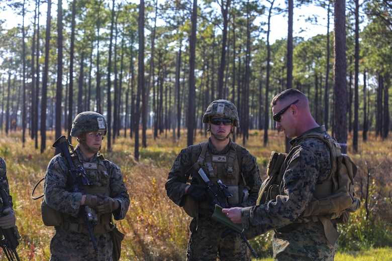 Chief Warrant Officer 2 Michael Hulsey briefs Marines after a training exercise at Camp Lejeune, N.C., Nov 16, 2016. The Marines practiced squad-sized movements in order to maintain unit readiness for their upcoming Integrated Training Exercise at the Marine Corps Air Ground Combat Training Center in Twentynine Palms, California. Hulsey is the infantry weapons officer for 1st Battalion, 8th Marine Regiment.  (U.S. Marine Corps Photo by Lance Cpl. Jon Sosner)