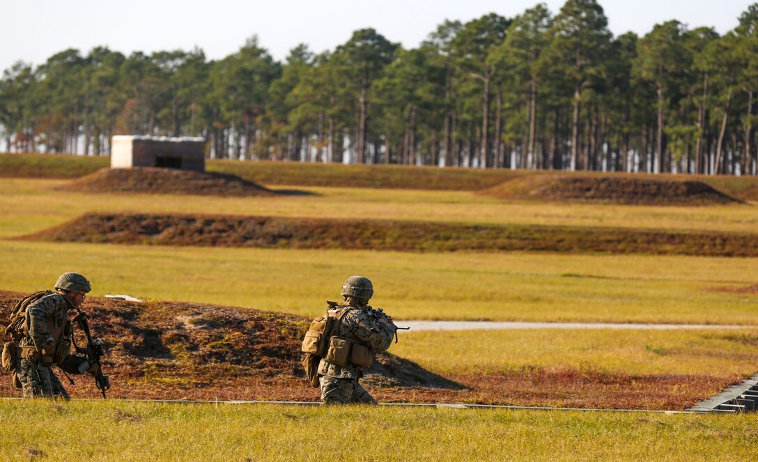 Marines move down into a trench to clear a building during a training exercise at Camp Lejeune, N.C., Nov 16, 2016. The Marines practiced squad-sized movements in order to maintain unit readiness for their upcoming Integrated Training Exercise at the Marine Corps Air Ground Combat Training Center in Twentynine Palms, California. The Marines are with 1st Battalion, 8th Marine Regiment.  (U.S. Marine Corps Photo by Lance Cpl. Jon Sosner)