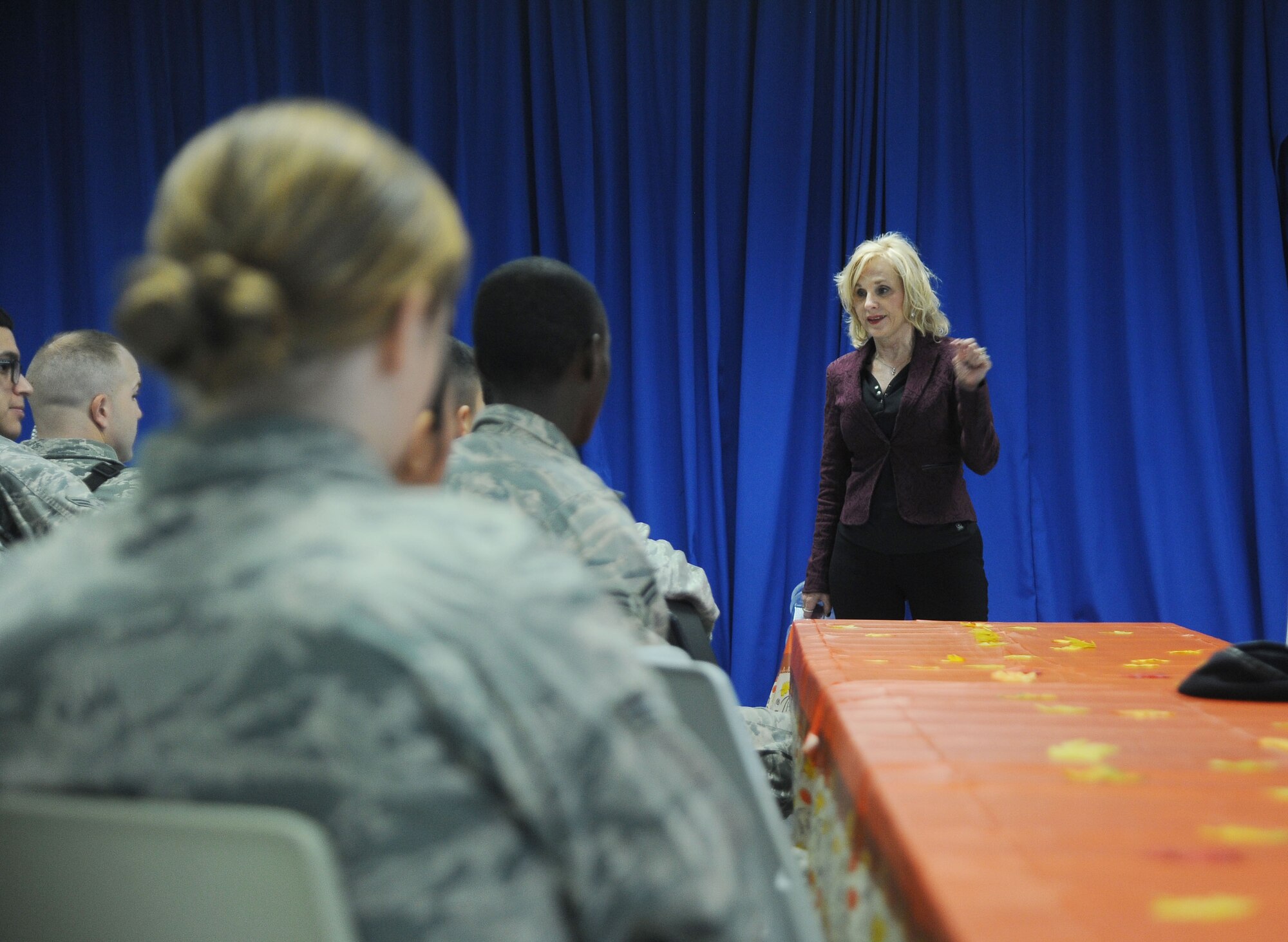 Joan Craft, the director of the Health and Wellness Center (HAWC), talks to members of the 6th Security Forces Squadron during the Great American Smokeout at MacDill Air Force Base, Fla., Nov. 17, 2016. The HAWC presented information and resources available for tobacco users to utilize when trying to quit. (U.S. Air Force photo by Airman Adam R. Shanks)