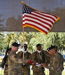 Col. Josh Burris (left) and Command Sgt. Maj. Charles Williams case the 410th Contracting Support Brigade organizational colors during a ceremony Nov. 16 at Joint Base San Antonio-Fort Sam Houston. Soldiers from the brigade will depart for a deployment to assume command of the U.S. Army Expeditionary Contracting Command-Afghanistan. Burris is the 410th CSB commander and Williams is the brigade command sergeant major.