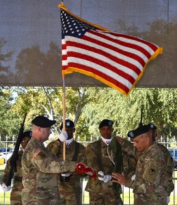 Col. Josh Burris (left) and Command Sgt. Maj. Charles Williams case the 410th Contracting Support Brigade organizational colors during a ceremony Nov. 16 at Joint Base San Antonio-Fort Sam Houston. Soldiers from the brigade will depart for a deployment to assume command of the U.S. Army Expeditionary Contracting Command-Afghanistan. Burris is the 410th CSB commander and Williams is the brigade command sergeant major.