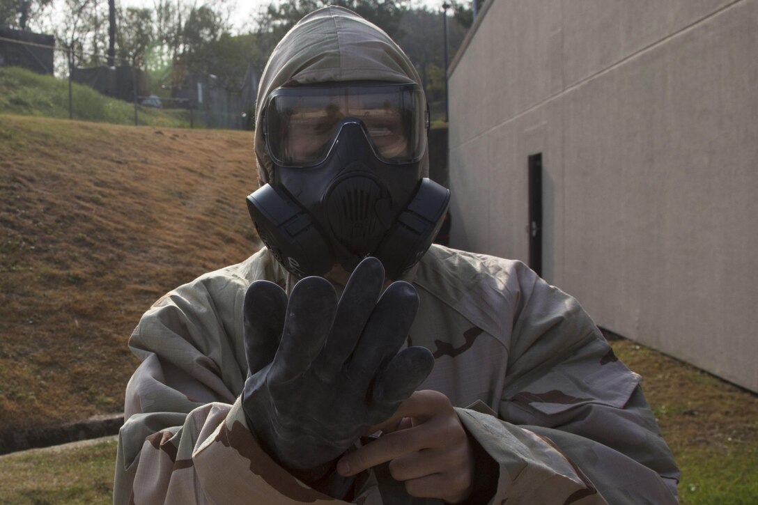 Marines and airmen work together at a simulated contamination control area as part of the Vigilant Ace 17-1 exercise at Osan Air Base, South Korea, Nov. 17, 2016. Vigilant Ace is a biannual, bilateral training event where U.S. and South Korean service members conduct interoperability exercises. Marine Corps photo by Lance Cpl. Jacob A. Farbo