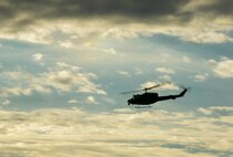 Members from the 54th Helicopter Squadron fly overhead during a recapture and recovery exercise at the missile complex, N.D., Nov. 16, 2016. The 54th HS provided air support during the scenario, which simulated hostile forces taking over a payload transporter. (U.S. Air Force photo/Senior Airman Apryl Hall)