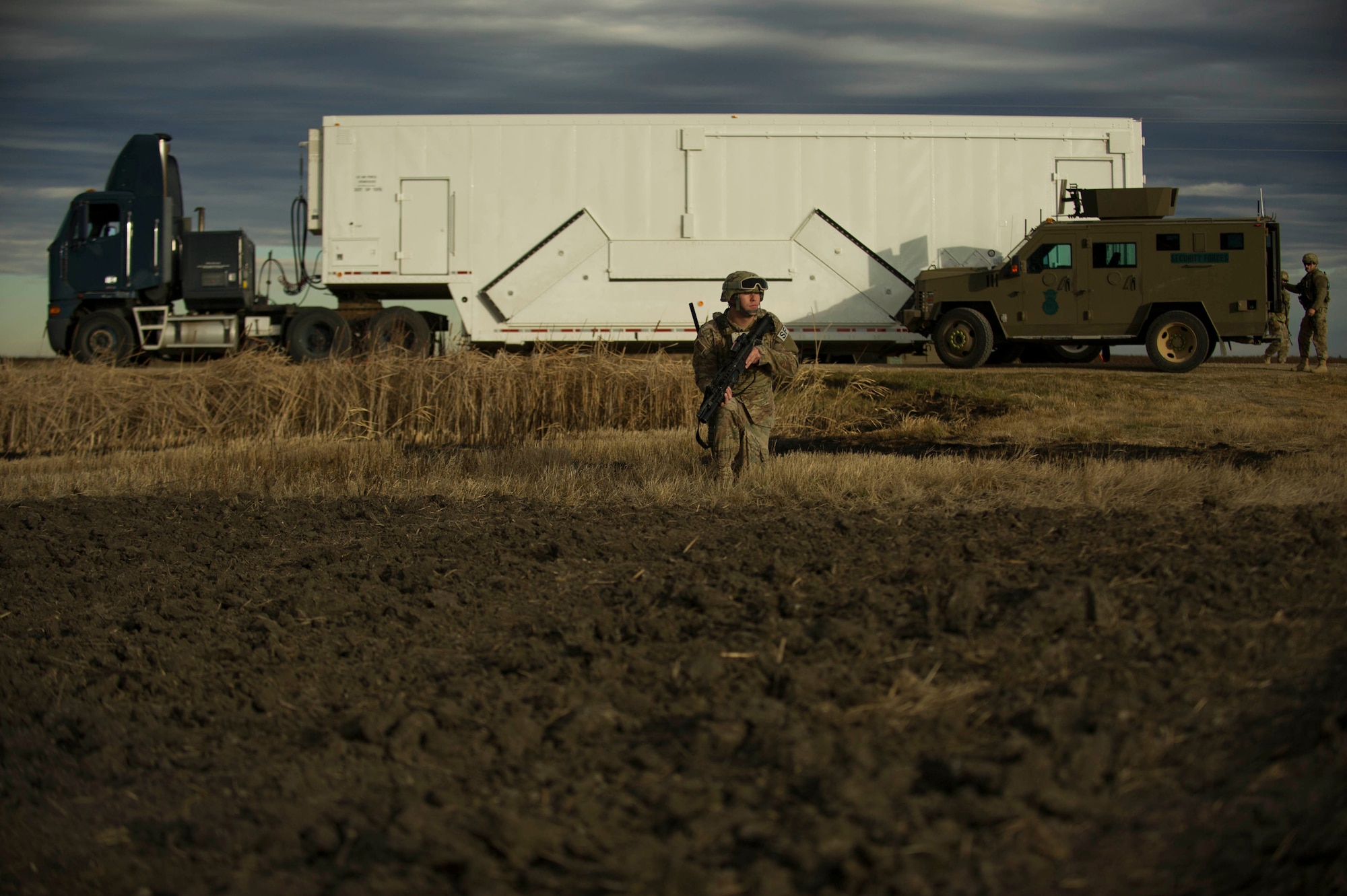 An Airman from the 791st Missile Security Forces Squadron provides security during a recapture and recovery exercise at the missile complex, N.D., Nov. 16, 2016. During the simulated scenario, defenders set up a security perimeter to watch for hostile forces. (U.S. Air Force photo/Senior Airman Apryl Hall)