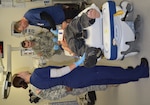 Sgt. Deantrea McInnis (left), mental health technician, and Capt. Lucas Rees (right), chaplain resident, speak to Ashley Giles (center), a nursing student at St. Phillip’s Nursing School, during a mass casualty exercise Nov. 9 at Brooke Army Medical Center. Giles tested their ability to not only deal with her physical injuries but also her emotions after a traumatic event such as an active shooter.