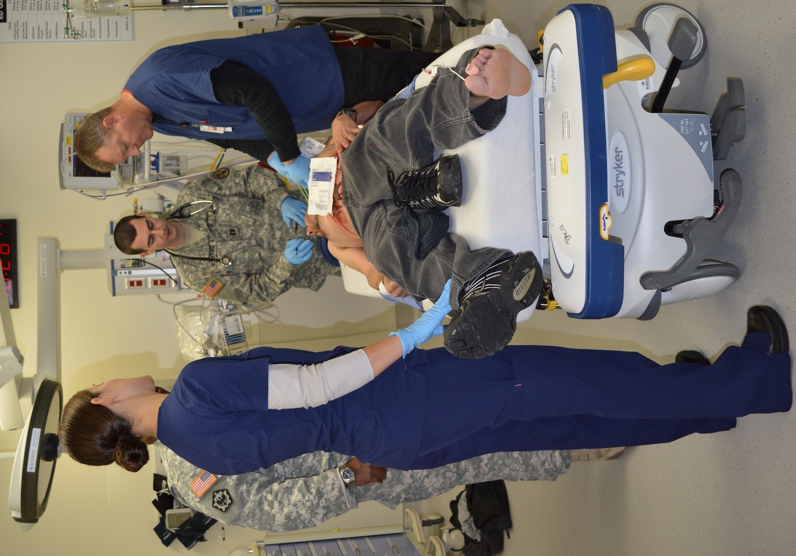 Sgt. Deantrea McInnis (left), mental health technician, and Capt. Lucas Rees (right), chaplain resident, speak to Ashley Giles (center), a nursing student at St. Phillip’s Nursing School, during a mass casualty exercise Nov. 9 at Brooke Army Medical Center. Giles tested their ability to not only deal with her physical injuries but also her emotions after a traumatic event such as an active shooter.