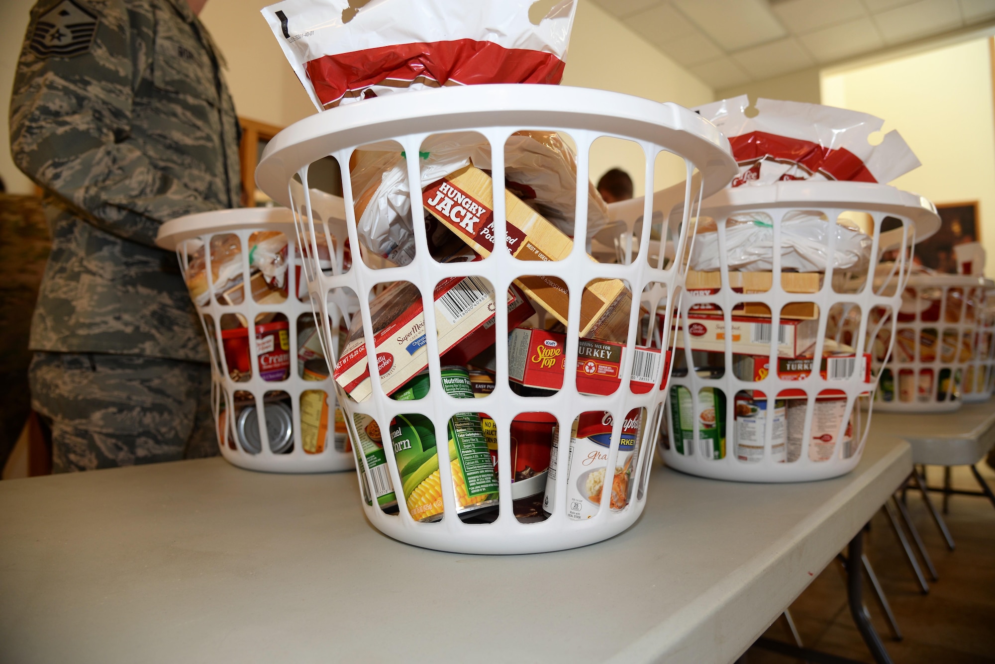 Thanksgiving baskets, put together by the first sergeants council and volunteers, pile up in the High Plains chapel at F.E. Warren Air Force Base, Wyo., Nov. 18, 2016.  125 baskets hold the makings of a great Thanksgiving meal and are funded through community members and the Combined Federal Campaign charity (code 19015). The first sergeants have been able to donate to Airmen for more than six years. The baskets will be delivered to junior-ranking Airmen, selected by their chain of command, to ensure their families are able to enjoy a Thanksgiving meal for the holiday. (U.S. Photo by 2d Lt. Nikita Thorpe)