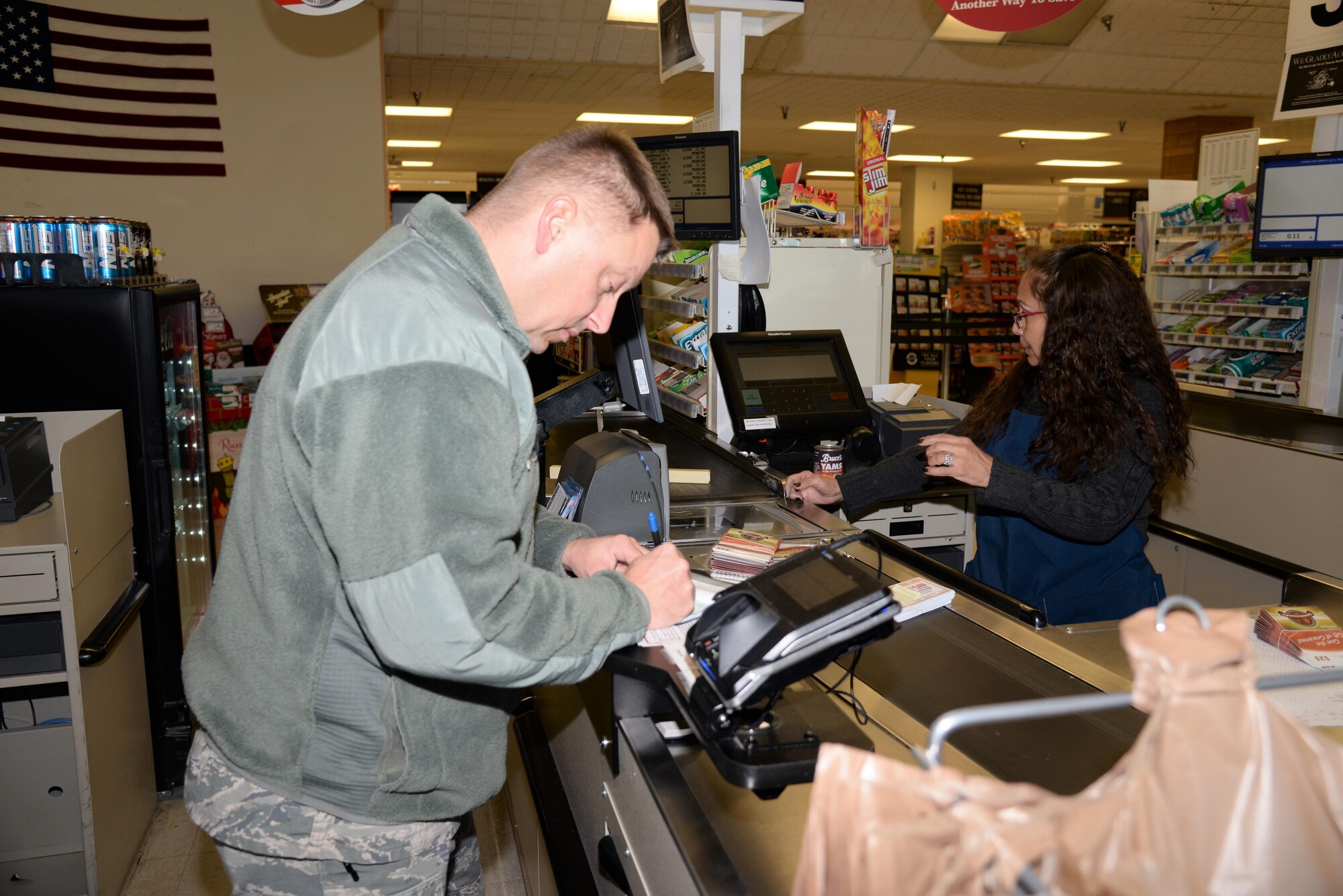 Master Sgt. Brandon Finefrock, 90th Missile Security Forces Squadron first sergeant, purchases commissary food items to assemble 125 Thanksgiving baskets at F.E. Warren Air Force Base, Wyo., Nov. 18, 2016.  Also known as OPERATION WARMHEART to the public, many of the funds are provided through community members and the Combined Federal Campaign charity (code 19015). The baskets will be delivered to junior-ranking Airmen, selected by their chain of command, to ensure their families are able to enjoy a Thanksgiving meal for the holiday. (U.S. Photo by 2d Lt. Nikita Thorpe)