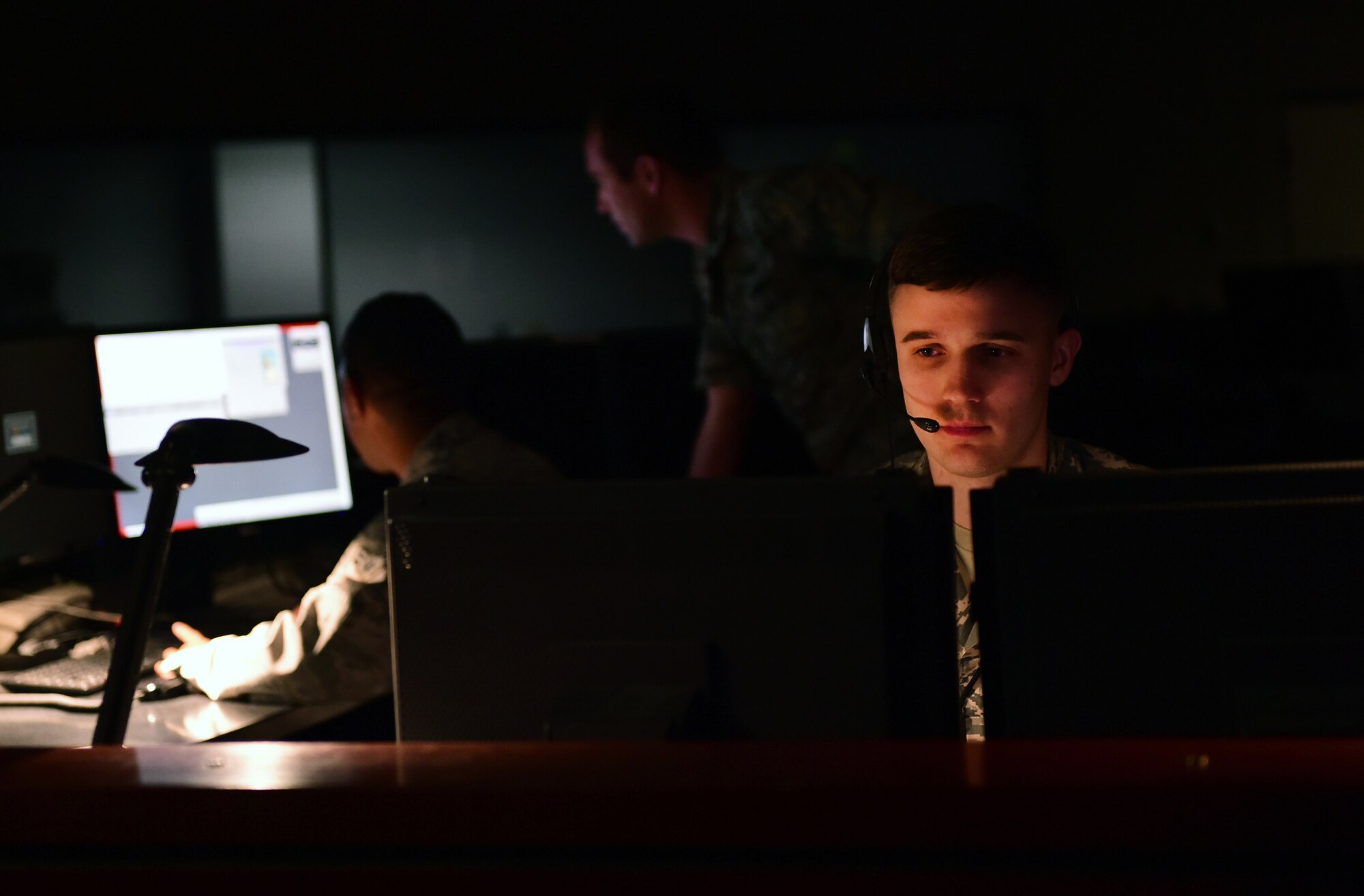 Senior Airman Dustin Curry, 2nd Space Warning Squadron data systems operator, provides essential information during a simulated missile launch Nov. 17, 2016, on Buckley Air Force Base, Colo. Airmen from the 2SWS simulated responding to a missile launch for the Aurora Defense Council demonstrate how Buckley Airmen provide unwavering support. (U.S. Air Force photo by Senior Airman Luke W. Nowakowski/Released)