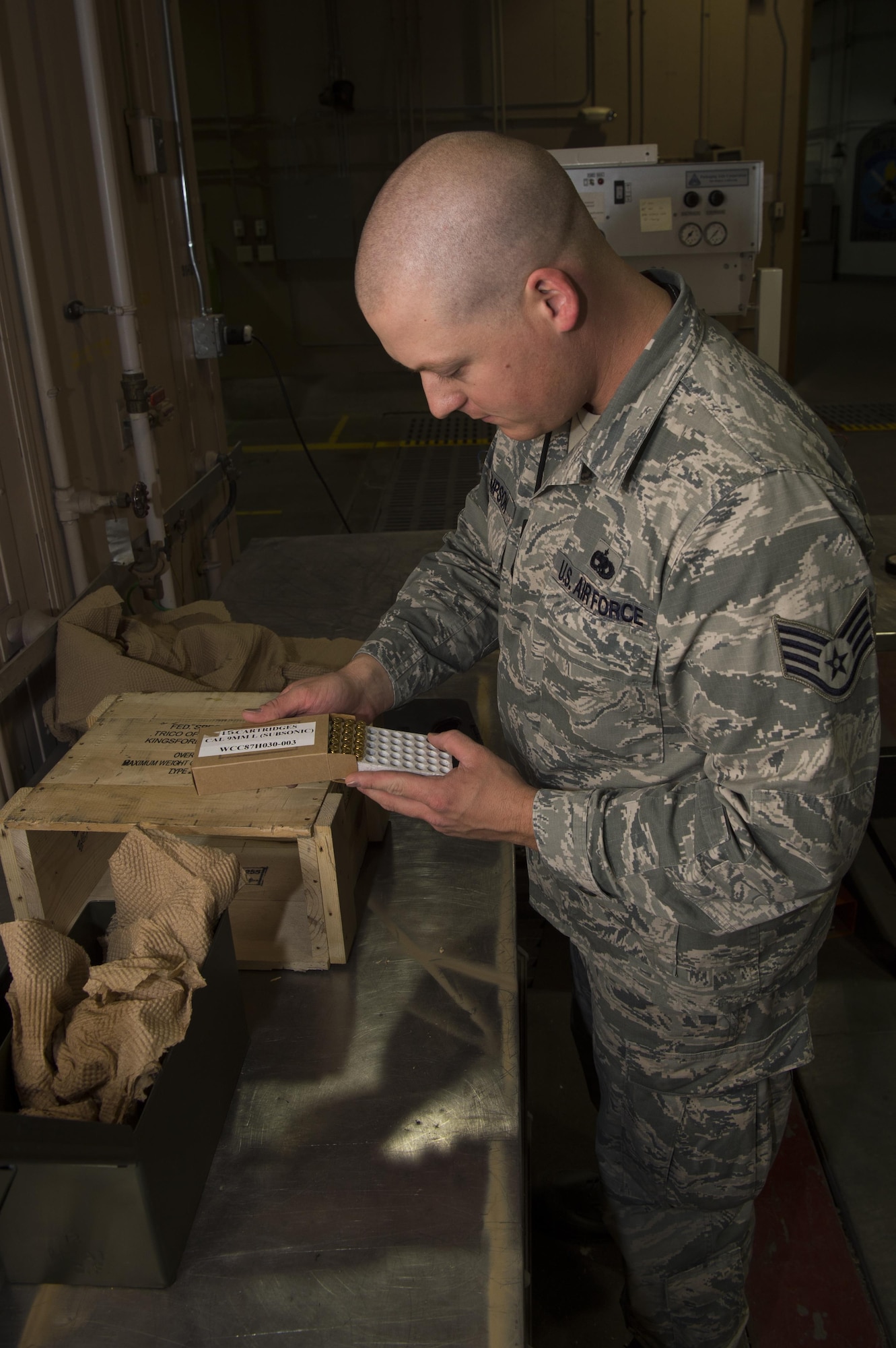 Staff Sgt. Bryan Thompson, 90th Munition Squadron munitions operations NCO in charge, performs inventory of 9mm ammunition at F.E. Warren Air Force Base, Wyo., Oct. 31, 2016. The 90th MUNS is responsible for the inventory and tracking of more than 7 million munitions. The 90th MUNS mission is to enable nuclear deterrence by maintaining combat ready munitions in defense of global freedoms safely, securely and effectively. (U.S. Air Force photo by Staff Sgt. Christopher Ruano)