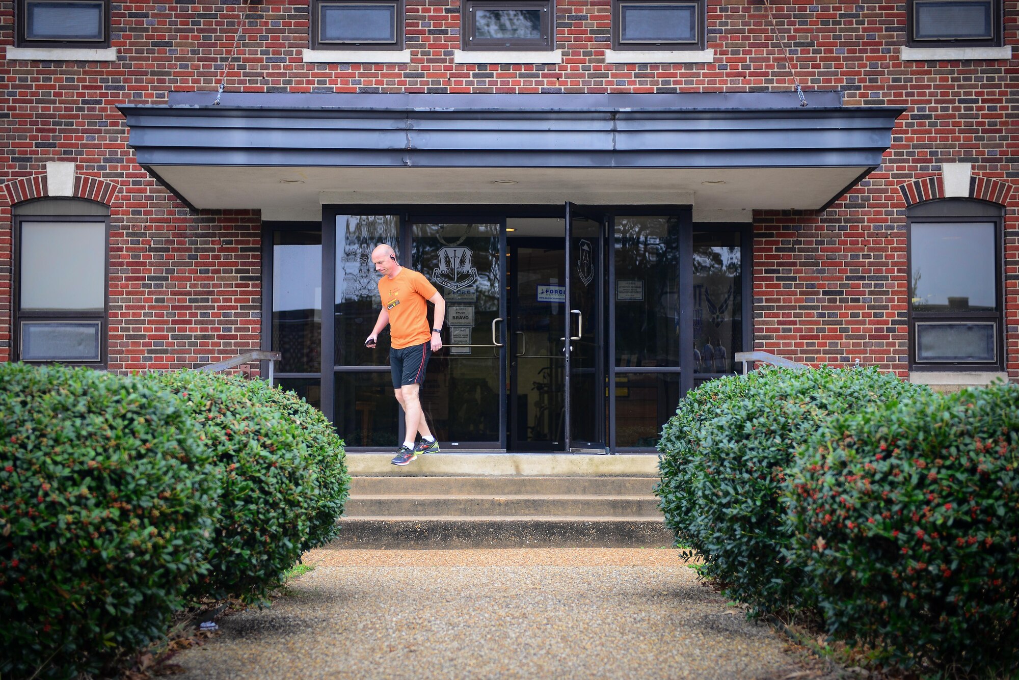 U.S. Air Force Maj. Glen Miller, 633rd Air Base Wing Legal Office executive officer, walks out of the Air Combat Command Fitness Center at Joint Base Langley-Eustis, Va., Nov. 9, 2016. The ACC Fitness Center has renovations scheduled in December. (U.S. Air Force photo by Master Sgt. Benjamin Wilson) 