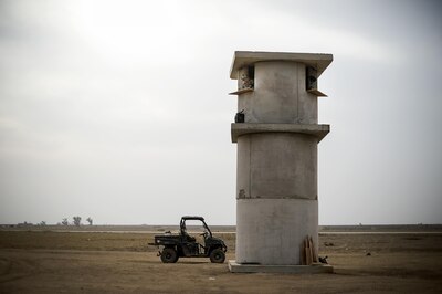 U.S. Air Force Senior Airman Devon Jones, 821st Contingency Response Group security forces, provides security from an outpost at Qayyarah West Airfield, Iraq, Nov. 16, 2016. The 821st CRG is highly-specialized in training and rapidly deploying personnel to quickly open airfields and establish, expand, sustain and coordinate air mobility operations in austere, bare-base conditions. (U.S. Air Force photo by Staff Sgt. Charles Rivezzo)