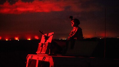 Senior Airman Johnathan Sorber, 821st Contingency Response Group first in security team member, scans the horizon while traveling to a defensive fighting position while on perimeter watch at Qayyarah West Airfield, Iraq, Nov. 17, 2016. The 821st CRG is highly-specialized in training and rapidly deploying personnel to quickly open airfields and establish, expand, sustain and coordinate air mobility operations in austere, bare-base conditions. (U.S. Air Force photo by Senior Airman Jordan Castelan)