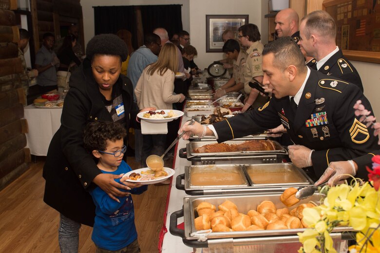 U.S. Army Soldiers and Hampton Roads Boy Scout members served Thanksgiving dinner to Gold Star families at the Survivor Outreach Services’ Thanks for Giving Potluck at Joint Base Langley-Eustis, Va., Nov. 17. 2016. The potluck brought together members of the JBLE community and Gold Star families to celebrate Thanksgiving and to remember service members who have died. (U.S. Air Force photo by Airman 1st Class Derek Seifert)