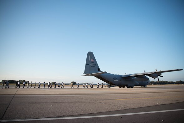 The Biloxi High School JROTC team boards a WC-130 Super Herculese aircraft. They won the Mississippi All Services JRTOC Drill Competition Nov. 18 at Keesler Air Force Base, Miss. and had a chance to fly with the 53rd Weather Reconnaissance Squadron Hurricane Hunters to learn more about the mission of the Air Force Reserve. (U.S. Air Force photo/Staff Sgt. Heather Heiney) 