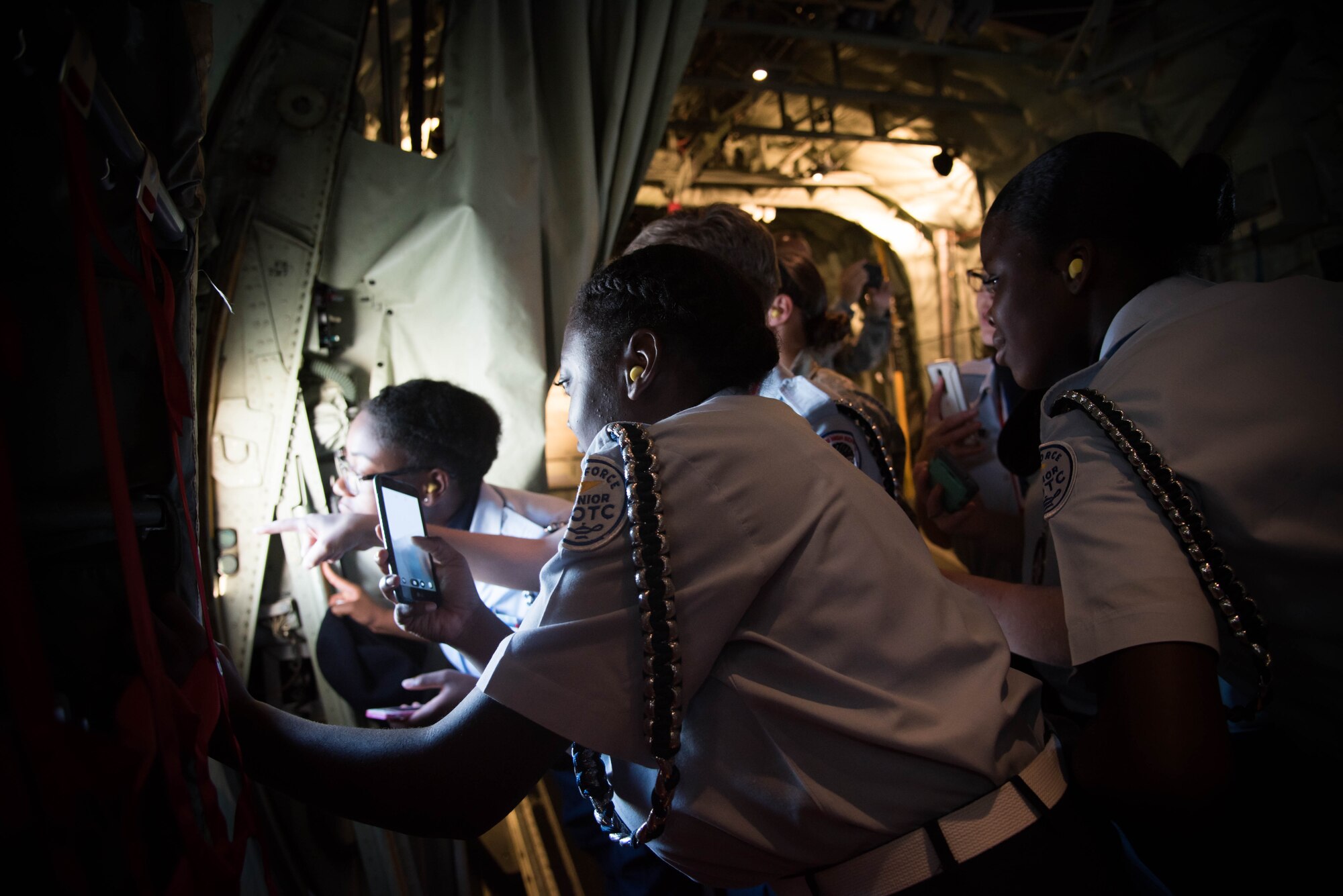 Members of the Biloxi High School JROTC team look out the window of a WC-130J Super Hercules aircraft. They won the Mississippi All Services JRTOC Drill Competition Nov. 18 at Keesler Air Force Base, Miss. and had a chance to fly with the 53rd Weather Reconnaissance Squadron Hurricane Hunters to learn more about the mission of the Air Force Reserve. (U.S. Air Force photo/Staff Sgt. Heather Heiney) 