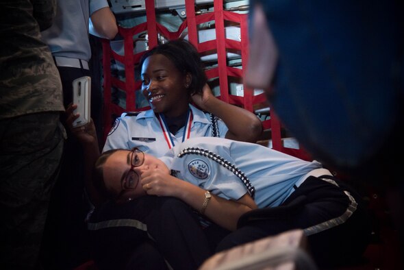 Michelle Campbell and Majia Freche, Biloxi High School JROTC students, fly on a WC-130J Super Herculese aircraft. Their team won the Mississippi All Services JRTOC Drill Competition Nov. 18 at Keesler Air Force Base, Miss. and had a chance to fly with the 53rd Weather Reconnaissance Squadron Hurricane Hunters to learn more about the mission of the Air Force Reserve. (U.S. Air Force photo/Staff Sgt. Heather Heiney) 