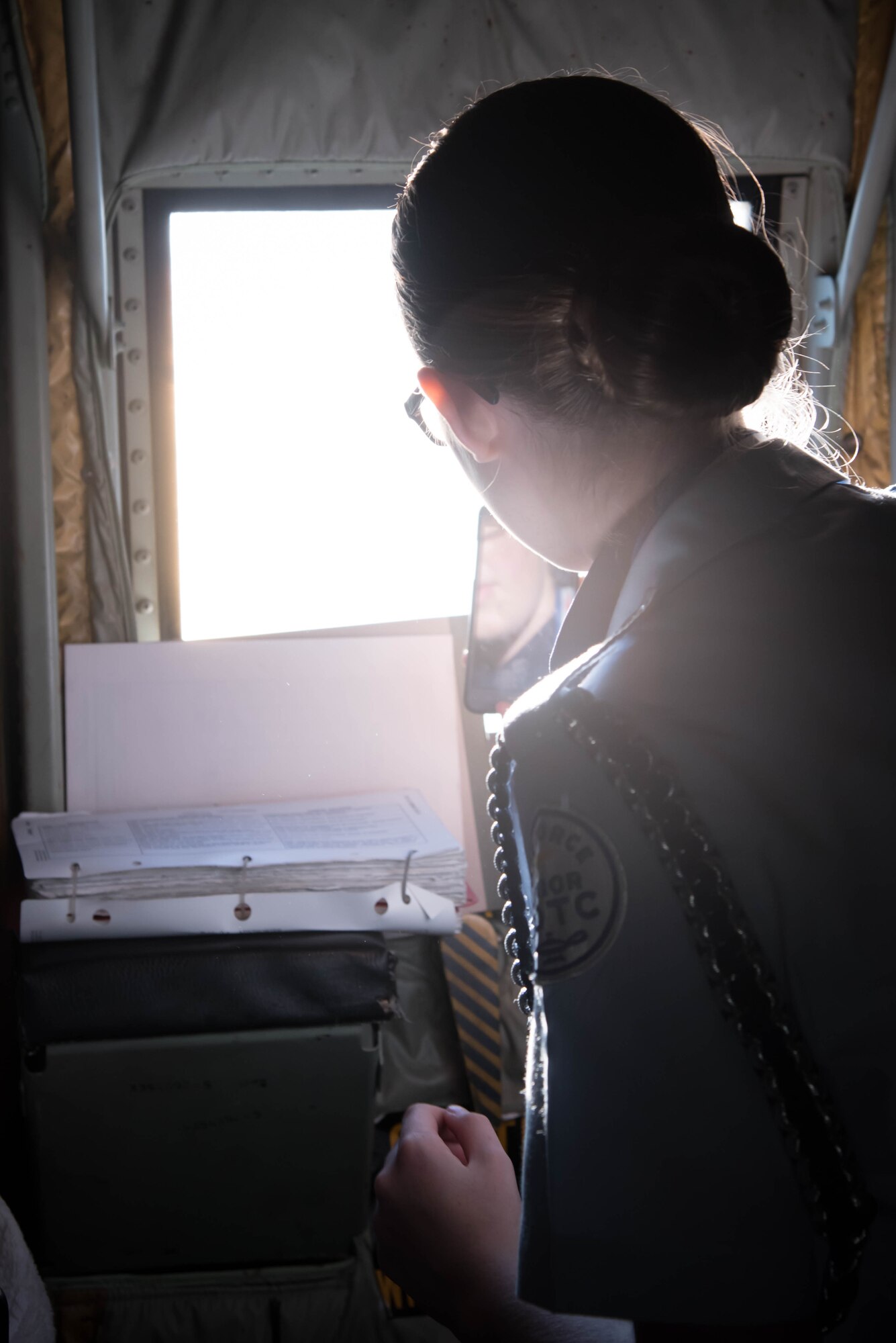 A student from the Biloxi High School JROTC team looks out the window of a WC-130J Super Herculese Aircraft. Her team won the Biloxi High School JROTC team won the Mississippi All Services JRTOC Drill Competition Nov. 18 at Keesler Air Force Base, Miss. and had a chance to fly with the 53rd Weather Reconnaissance Squadron Hurricane Hunters to learn more about the mission of the Air Force Reserve. (U.S. Air Force photo/Staff Sgt. Heather Heiney) 