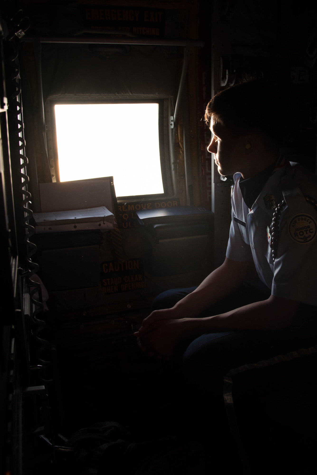 A student from the Biloxi High School JROTC team looks out the window of a WC-130J Super Herculese Aircraft. His team won the Biloxi High School JROTC team won the Mississippi All Services JRTOC Drill Competition Nov. 18 at Keesler Air Force Base, Miss. and had a chance to fly with the 53rd Weather Reconnaissance Squadron Hurricane Hunters to learn more about the mission of the Air Force Reserve. (U.S. Air Force photo/Staff Sgt. Heather Heiney) 