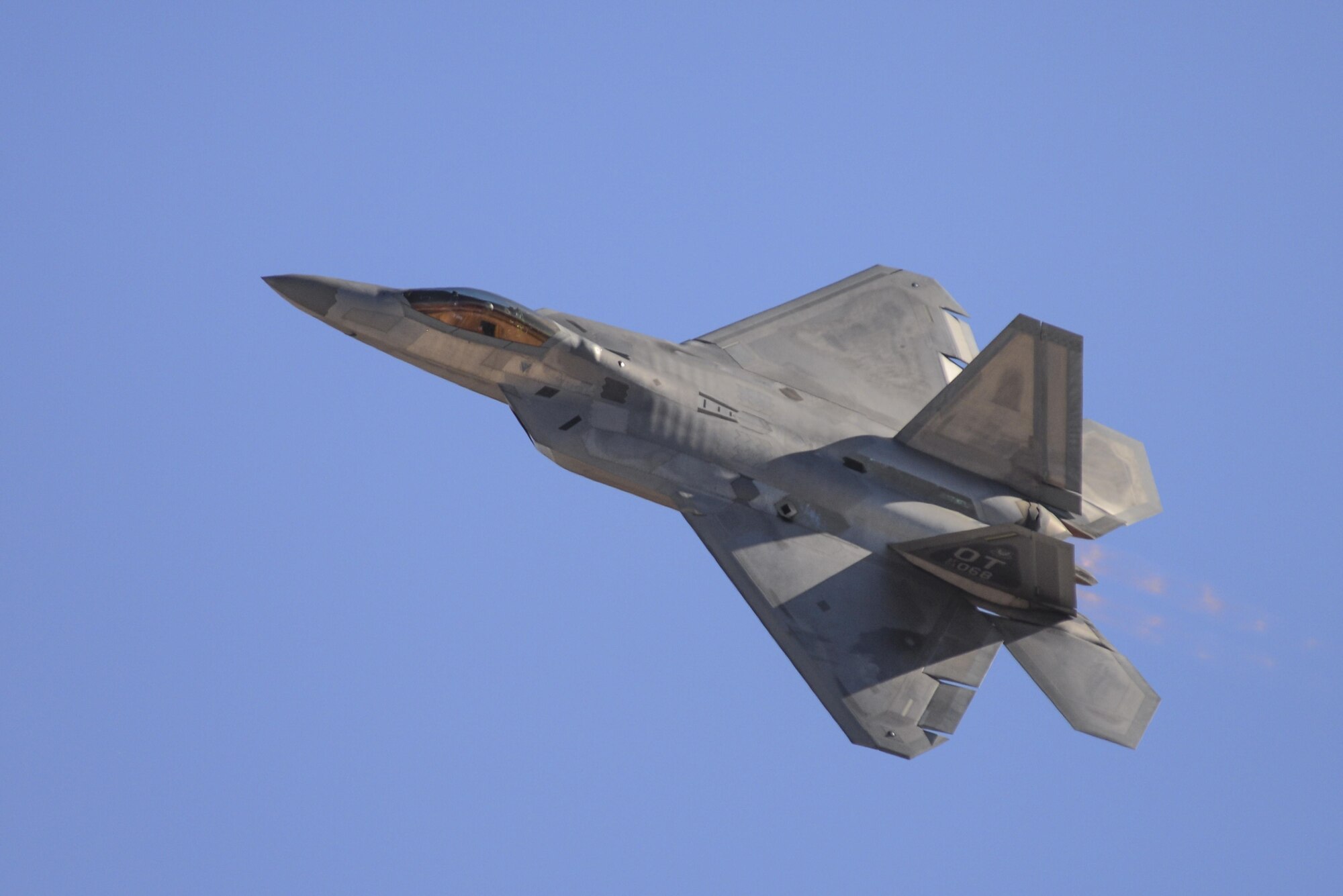 U.S. Air Force Maj. Dan Dickinson, F-22 Raptor Demonstration Team pilot, executes a transition maneuver during the 2016 Air Power over Southern Nevada Air Show at Nellis Air Force Base, Nev., Nov. 13, 2016.  This air show celebrated 75 years of Nellis Air Force Base, which is home to the F-22 Operational Training Wing.  (U.S. Air Force photo by 2nd Lt. Mahalia Frost)