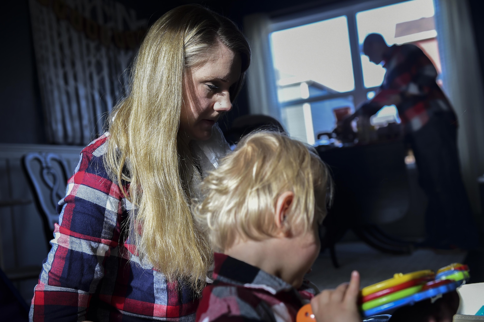 Mandy Wren-a Douglas plays with her son, Dean Fredric Douglas, Nov. 2, 2016, at their family home in Colorado Springs, Colo. While her husband works at Peterson Air Force Base, Colo., Mandy stays at home with their three-year-old twin boys to take them to doctors appointments, take care of their typical daily routines and maintain the house. Dean and Luke were both born premature at 23 weeks, 17 weeks earlier than normal. (U.S. Air Force photo by Airman 1st Class Gabrielle Spradling/Released)