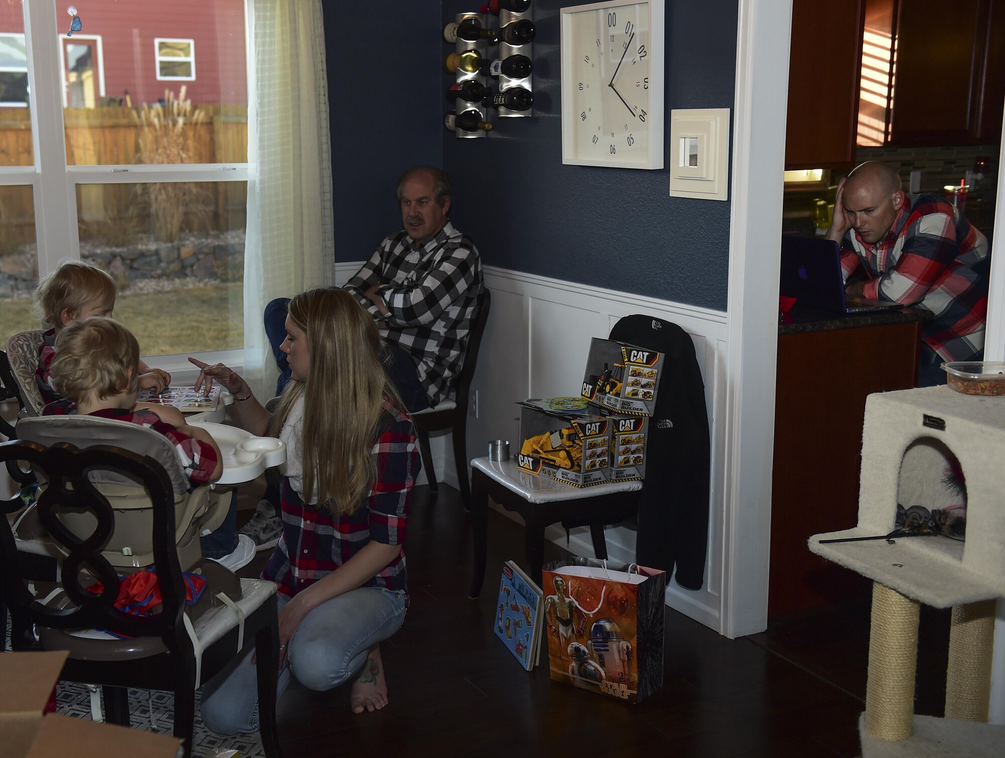 The Douglas family celebrates the third birthday of their twin boys Nov. 2, 2016, at their family home in Colorado Springs, Colo. Capt. Matthew Douglas, Air Force Space Command logistical and support officer, not only works on Peterson Air Force Base, Colo., he also goes to school and helps his wife, Mandy Wren-a Douglas, take care of their twin boys. He must find whatever time he can to complete all of his tasks. (U.S. Air Force photo by Airman 1st Class Gabrielle Spradling/Released)
