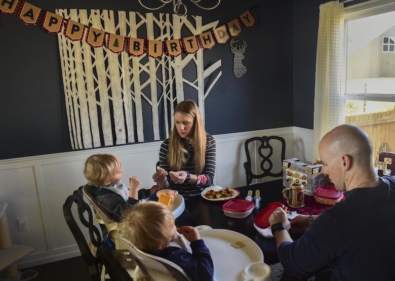 Mandy and Capt. Matthew Douglas feed their children Nov. 3, 2016, in Colorado Springs, Colo. The twins, born premature at 23 weeks, 17 weeks earlier than normal, celebrated their third birthday with family Nov. 2. Being able to feed the children together is a rarity due to Matthew Douglas’ position as a logistical and support officer for Air Force Space Command. (U.S. Air Force photo by Airman 1st Class Gabrielle Spradling/Released)