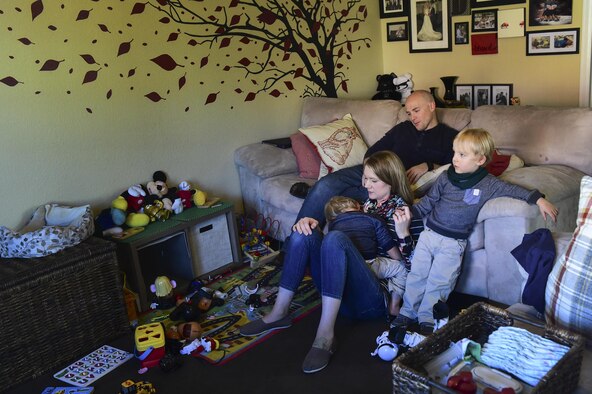 The Douglas family sits together Nov. 3, 2016, at their home in Colorado Springs, Colo. The parents not only tackle everyday tasks, such as keeping a clean house and working, but they also take care of their twin boys who suffer from many medical issues due to a complicated, premature birth. (U.S. Air Force photo by Airman 1st Class Gabrielle Spradling/Released)