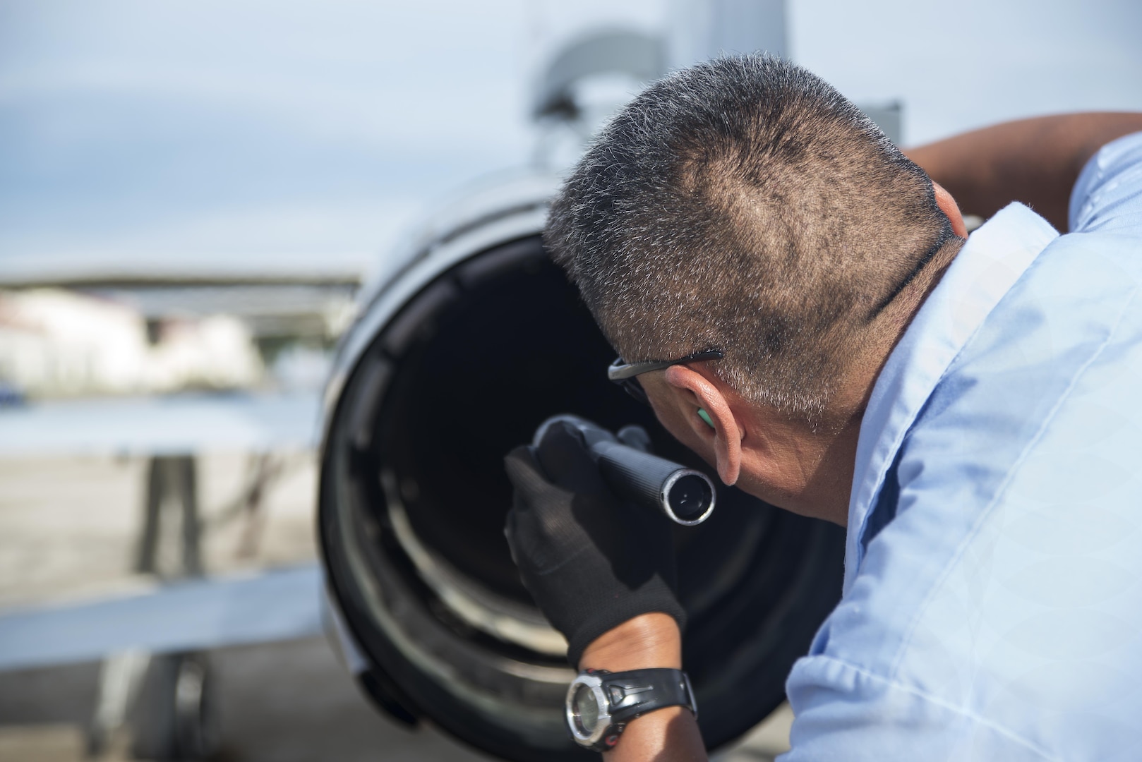 Chris Bahe, 12th Flying Training Wing T-38C Talon II crew chief, checks a T-38C engine during a pre-flight walk-around inspection at Joint Base San Antonio-Randolph Nov. 8, 2016. As a crew chief, Bahe supports the 435th Fighter Training Squadron, which trains approximately 150 students annually from the United States, Iraq, Japan, Poland, Saudi Arabia and Singapore. (U.S. Air Force photo by Airman 1st Class Lauren Ely/Released)