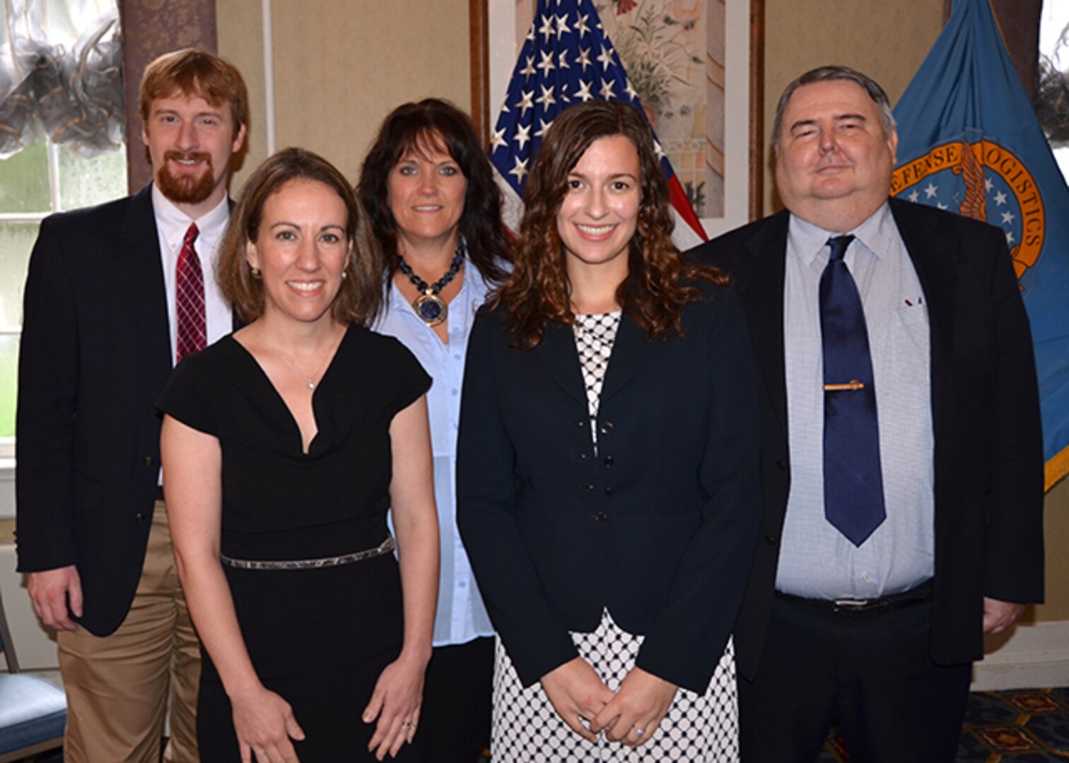 Defense Logistics Agency Counsel – Aviation’s Personnel Law Team recently demonstrated their commitment to DLA’s strategic goals, specifically Warfighter First and People and Culture, with the face of an unexpected, extended absence of a fellow team member. Team members, left to right, Daniel Moebs, Tiffany Higuchi, Tammy Draper, Katherine Yourth, and David Evers pose for a group photo at a retirement ceremony Sept. 29, 2016 held on Defense Supply Center Richmond, Virginia.  