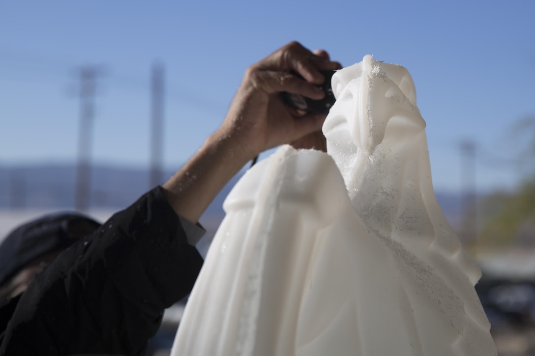 A Sodexo employee puts the finishing touches on an American Bald Eagle ice sculpture during preparation for the Marine Corps birthday meal at Phelps Mess Hall, Nov. 10, 2016. The Marine Corps’ birthday is one of the many traditions that Marines take great pride in celebrating annually. (Official Marine Corps photo be Cpl. Medina Ayala-Lo/Released)