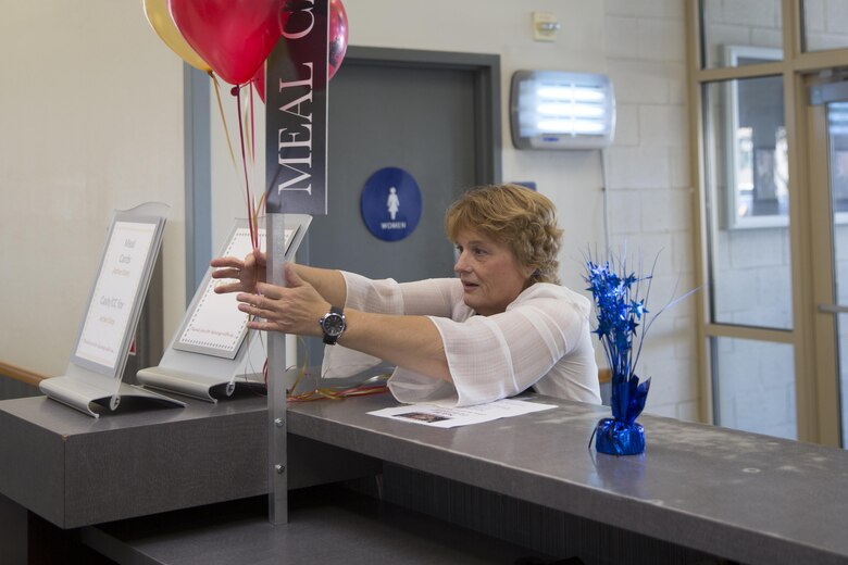 Roxanne Lopez, operation manager, Phelps Mess Hall, sets up decorations during preparation for the Marine Corps birthday meal at Phelps Mess Hall, Nov. 10, 2016. The Marine Corps’ birthday is one of the many traditions that Marines take great pride in celebrating annually. (Official Marine Corps photo be Cpl. Medina Ayala-Lo/Released)