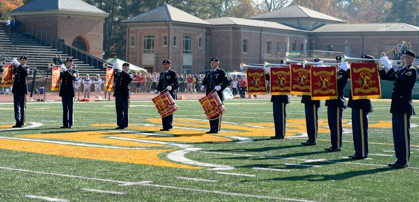 U.S. Army Training and Doctrine Command Band Herald Trumpets perform the colors at the College of William & Mary military appreciation game at Zable Stadium in Williamsburg, Va., Nov. 19, 2016. The Herald Trumpets consist of an ensemble of both soprano and tenor instruments, to produce the sound of a full-bodied orchestral brass section. (U.S. Air Force photo by Airman 1st Class Kaylee Dubois)