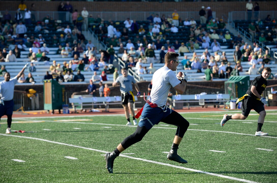U.S. Air Force Senior Airman Mark, 30th Intelligence Squadron imagery analyst, attempts to make a touchdown at the College of William & Mary military appreciation game at Zable Stadium in Williamsburg, Va., Nov. 19, 2016. The military appreciation game also showcased a field goal kickoff challenge for the chance to win $1,000. (U.S. Air Force photo by Airman 1st Class Kaylee Dubois)