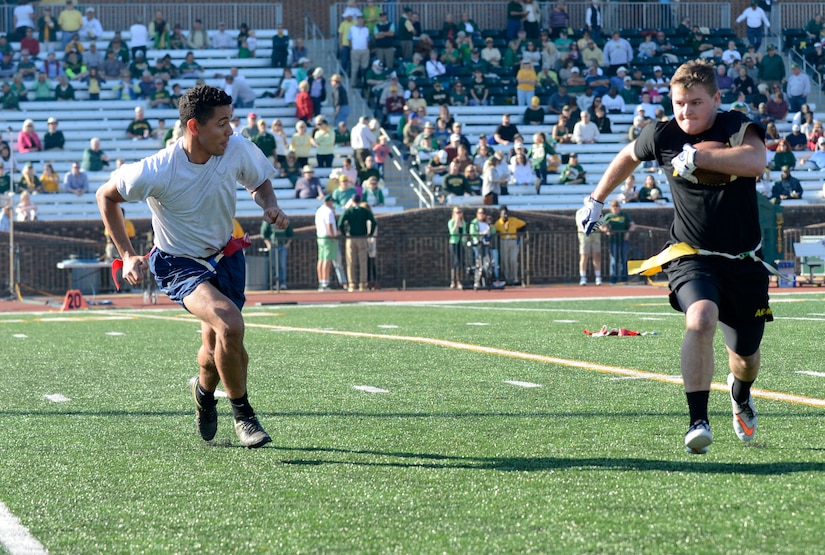 U.S. Air Force Senior Airman Courtland Banks, 1st Aircraft Maintenance Squadron maintenance supply technician, chases a member of the U.S. Army flag football team during the College of William & Mary military appreciation game at Zable Stadium in Williamsburg, Va., Nov. 19, 2016. This was the first year the U.S. Air Force was invited to the William & Mary military appreciation football game. (U.S. Air Force photo by Airman 1st Class Kaylee Dubois)