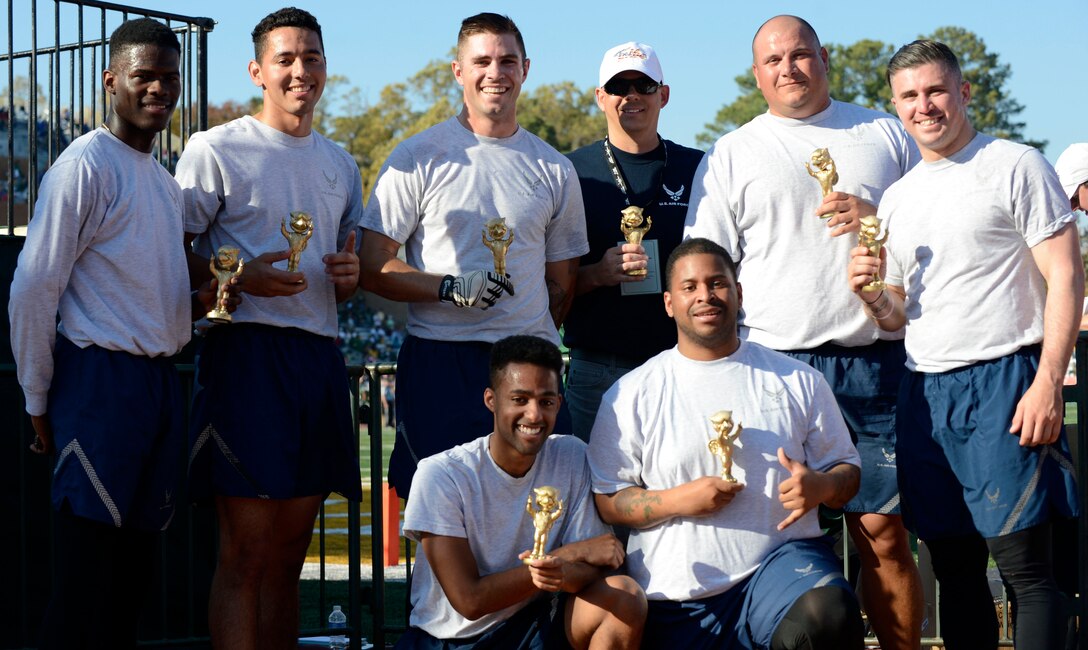 Members of the U.S. Air Force flag football team hold their trophies after defeating the U.S. Army flag football team at the College of William & Mary military appreciation game at Zable Stadium in Williamsburg, Va., Nov. 19, 2016. The U.S. Air Force team defeated the U.S. Army team with 3-1 touchdowns. (U.S. Air Force photo by Airman 1st Class Kaylee Dubois)