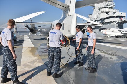 Over 450 U.S. Navy Nuclear Power Training Command students and staff assisted in cleaning and maintaining the USS Yorktown (CV-10) on Nov. 18, 2016, at Patriots Point Naval and Maritime Museum, Charleston, South Carolina, during the Trident United Way’s Day of Caring event. More than 5,000 people in the tri-county area volunteered during the annual Day of Caring event. (U.S. Air Force photos by Airman 1st Class Kevin West)