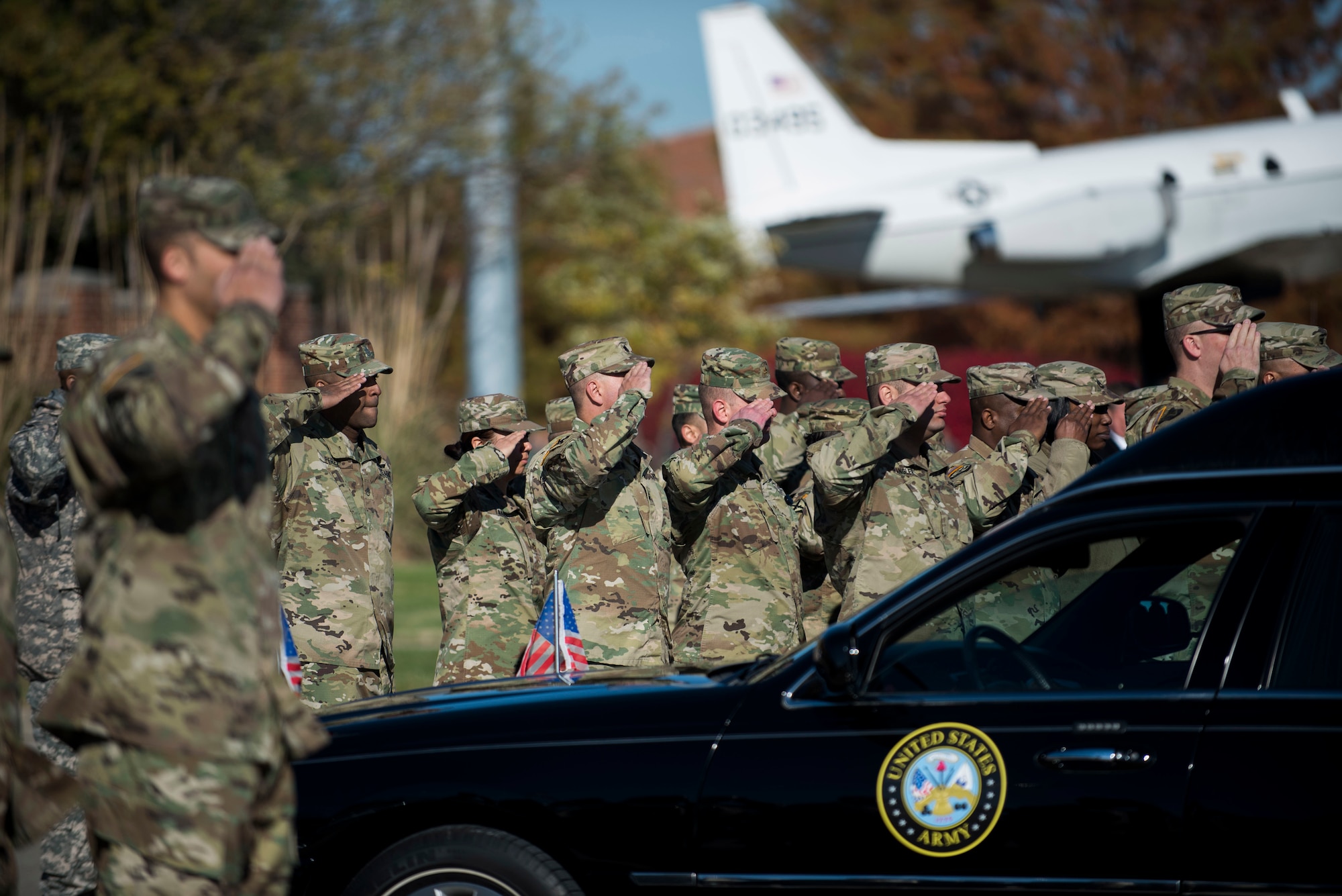 Soldiers stationed at Scott Air Force Base, Illinois salute during a dignified transfer ceremony for Pfc. Tyler Iubelt 21 Nov., 2016, at Scott Air Force Base, Illinois. Iubelt passed away on 12 Nov. while deployed to Bagram, Afghanistan. (U.S. Air Force photo by Staff Sgt. Clayton Lenhardt)