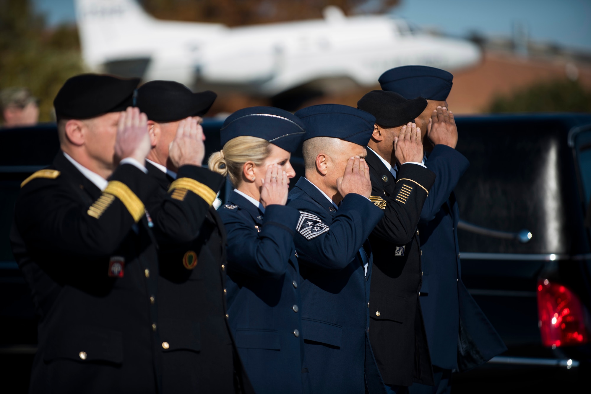 Senior leaders from Scott Air Force Base, Illinois salute during a dignified transfer ceremony for Pfc. Tyler Iubelt 21 Nov., 2016, at Scott Air Force Base, Illinois. Iubelt passed away on 12 Nov. while deployed to Bagram, Afghanistan. (U.S. Air Force photo by Staff Sgt. Clayton Lenhardt)