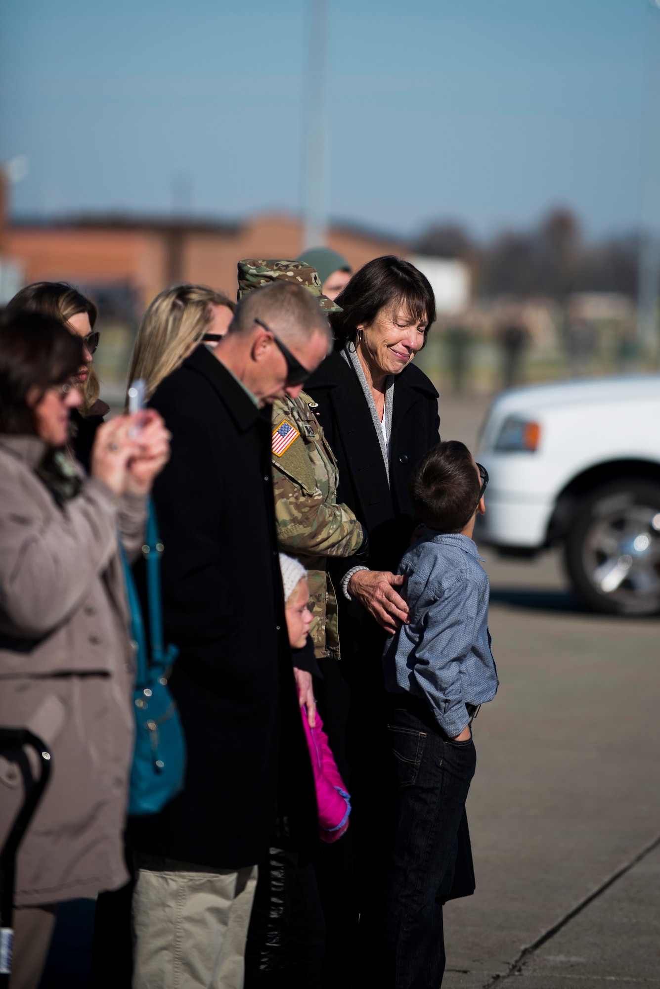 The family of Pfc. Tyler Iubelt comforts each other during his dignified transfer ceremony 21 Nov., 2016, at Scott Air Force Base, Illinois. Iubelt passed away on 12 Nov. while deployed to Bagram, Afghanistan. (U.S. Air Force photo by Staff Sgt. Clayton Lenhardt)