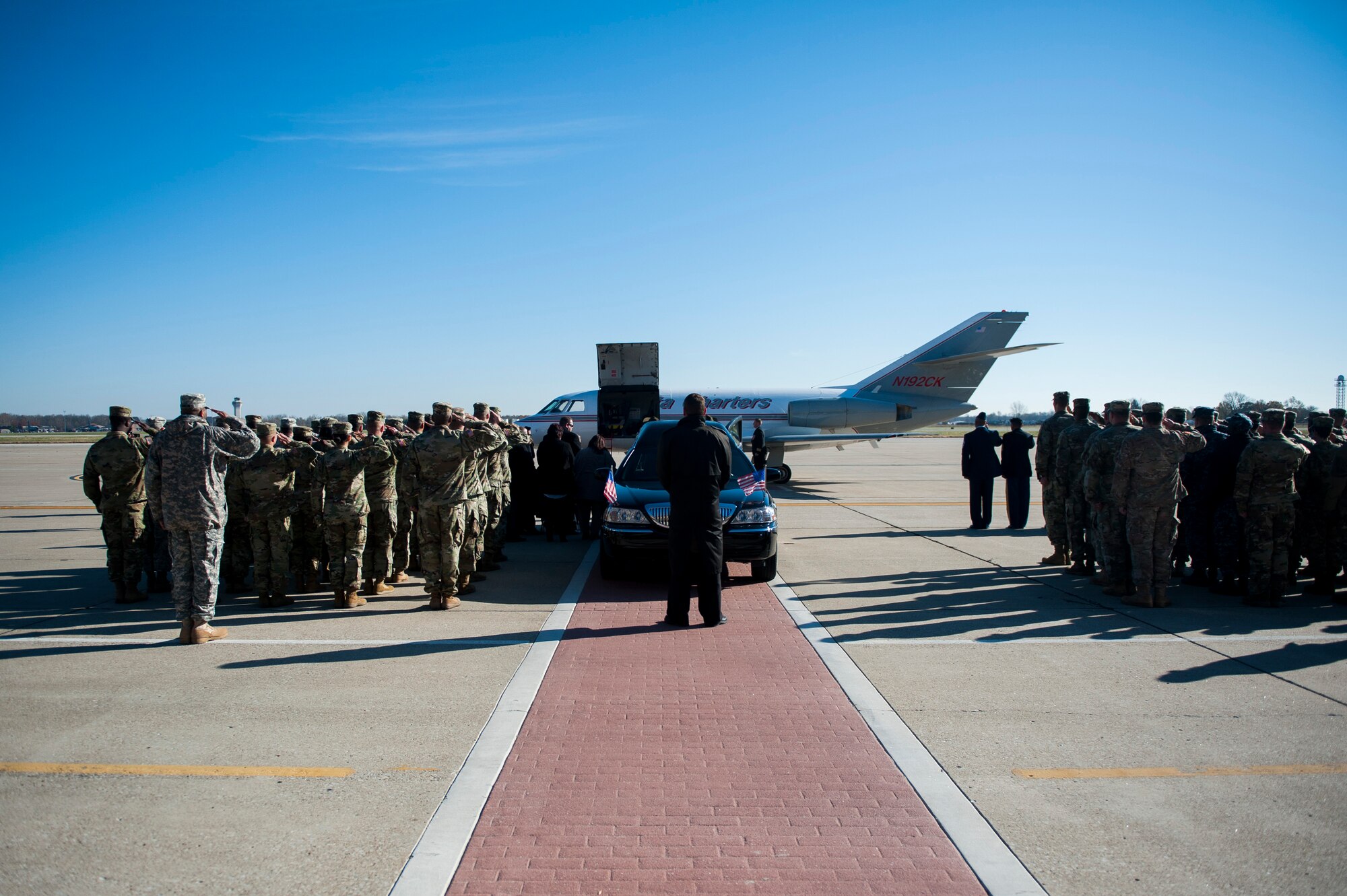 Members of Scott Air Force Base, Illinois salute during a dignified transfer ceremony for Pfc. Tyler Iubelt 21 Nov., 2016. Iubelt passed away on 12 Nov. while deployed to Bagram, Afghanistan. (U.S. Air Force photo by Staff Sgt. Clayton Lenhardt)