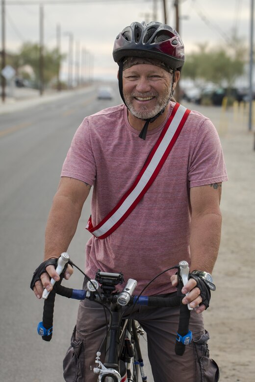 Chuck Hill, compliance support supervisor, Natural Resources and Environmental Affairs, gets on his bike to ride for “Get on Your Bike and Ride” month aboard Marine Corps Air Ground Combat Center, Twentynine Palms, Calif., Nov. 16, 2016. Hill logged more than 1,197 miles over the 29-day event. (Official Marine Corps photo by Cpl. Levi Schultz/Released)