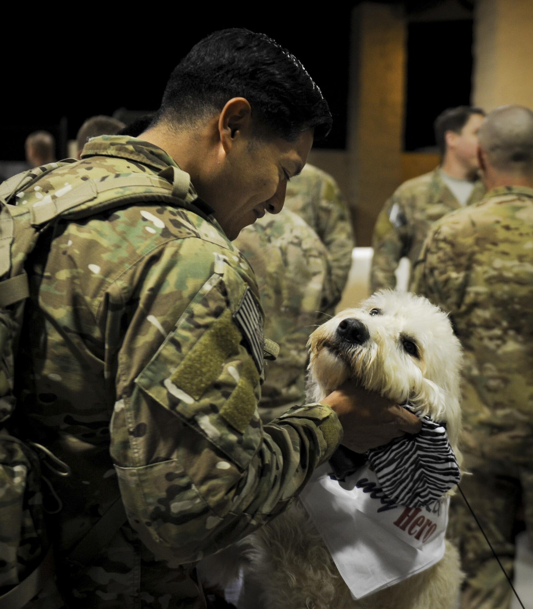 Tech. Sgt. Ronald Amaro, the NCO-in charge of the Deployed Air Ground Response Element with the 1st Special Operations Security Forces Squadron, greets his dog during Operation Homecoming at Hurlburt Field, Fla., Nov. 10, 2016. Returning Air Commandos were welcomed home by family, friends and coworkers. (U.S. Air Force photo by Airman Dennis Spain)