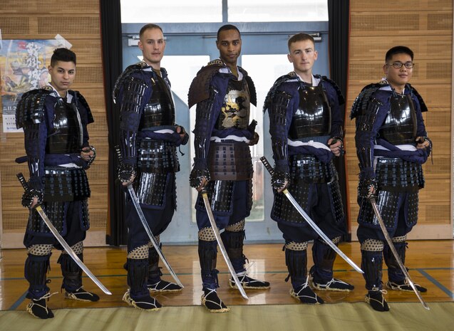 U.S. Marines from Marine Corps Air Station Iwakuni pose for a picture at the 27th annual Kuragake Festival and Samurai Parade in Iwakuni City, Japan, Nov. 20, 2016. The Marines were transformed from service members to samurai warroirs with traditional samurai armor, swords, spears and helmets before marching down the streets of Kuga demonstrating their strength and courage before going to battle. (U.S. Marine Corps photo by Sgt. Nicole Zurbrugg)