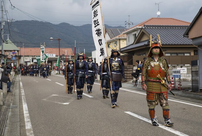Samurai march down the street during the 27th annual Kuragake Festival and Samurai Parade in Iwakuni City, Japan, Nov. 20, 2016. U.S. Marines from Marine Corps Air Station Iwakuni joined the local Japanese in transforming into samurai warriors to march in the parade, commemorating their great battle of 1555. (U.S. Marine Corps photo by Sgt. Nicole Zurbrugg)