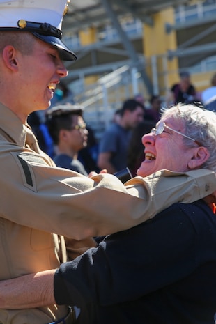 A Marine from Mike Company, 3rd Recruit Training Battalion, hugs his loved one after graduating from recruit training at Marine Corps Recruit Depot San Diego, Nov. 18. Graduation comes after the completion of all tests and events during the 13 weeks of training. Annually, more than 17,000 males recruited from the Western Recruiting Region are trained at MCRD San Diego.