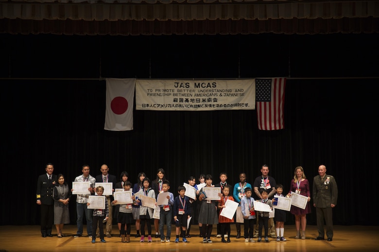 Contestants pose for a picture after receiving their awards at the 55th Annual Japanese and English Speech Contest at Iwakuni Sinfonia in Iwakuni City, Japan, Nov. 13, 2016. The speech contest brought residents and local Japanese together, building stronger bonds while learning a new language and culture. (U.S. Marine Corps photo by Sgt. Carlos Cruz)