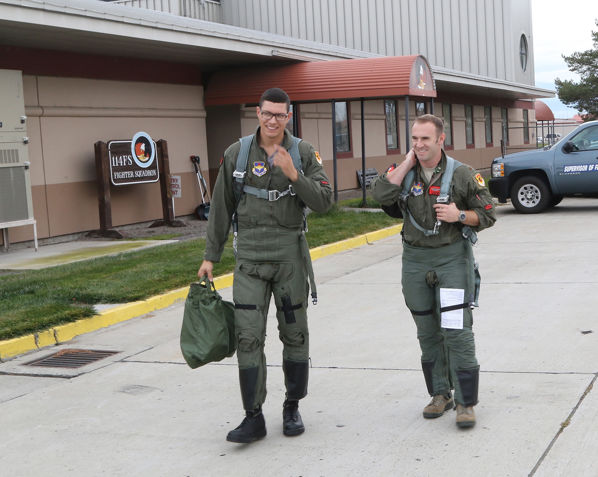U.S. Marine Staff Sgt. (ret.) Charlie Linville, who was medically retired after suffering an IED blast in Afghanistan, suffering an amputation, PTSD and a lower spine injury walks to a waiting F-15 with U.S. Air Force Maj. William Sullivan, 56th Operations Group Detachment 2, for a familiarization flight at Kingsley Field in Klamath Falls, Oregon Nov. 14, 2016. After recovering from his physical and mental injuries Linville became the first combat injured veteran to summit Mt. Everest the highest peak in the world in May of 2016. (U.S. Air National Guard photo by Tech. Sgt. Jefferson Thompson)