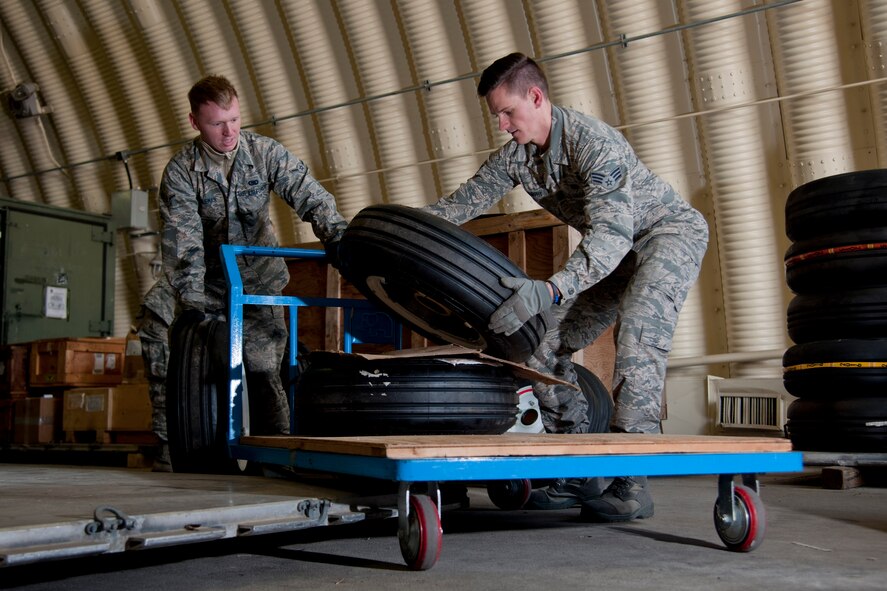 U.S. Air Force Airman Joshua Fogleman, 51st Logistics Readiness Squadron material management apprentice, and Senior Airman Dustin Murphy, 51st LRS mobility readiness spare package journeyman, load tires onto a cart at the aircraft parts store on Osan Air Base, Republic of Korea, Nov. 16, 2016. The APS is a one-stop shop for maintainers to get the parts needed to keep up “fight tonight” readiness. (U.S. Air Force photo by Staff Sgt. Jonathan Steffen)